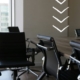 Empty chairs around an office desk