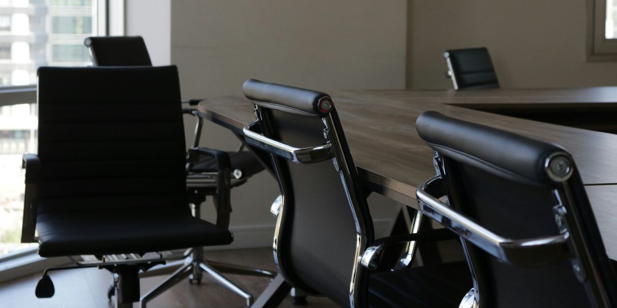 Empty chairs at an office desk