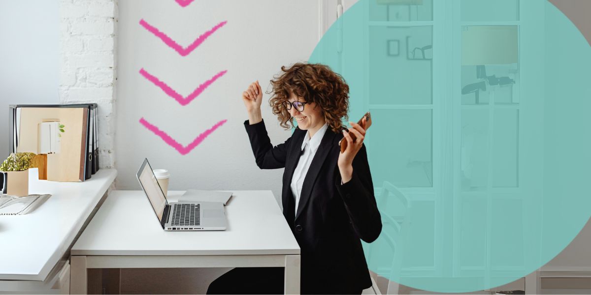 Happy woman sat at desk