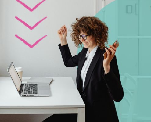 Happy woman sat at a desk