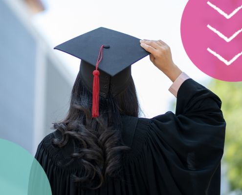 Graduate wearing a cap and gown with their back to the camera, considering their career path after university