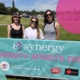 Team Synergy stood behind their Charity Sports Day banner