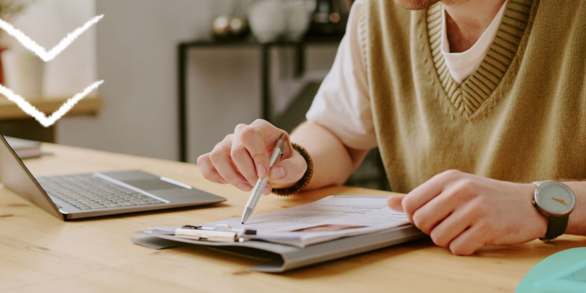 Person sat at a desk reading a CV