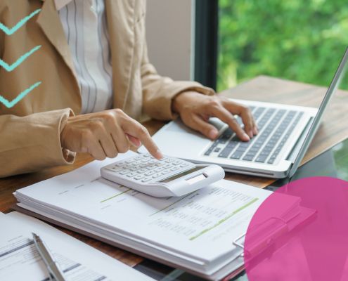 business owner reviewing recruitment costs on a laptop