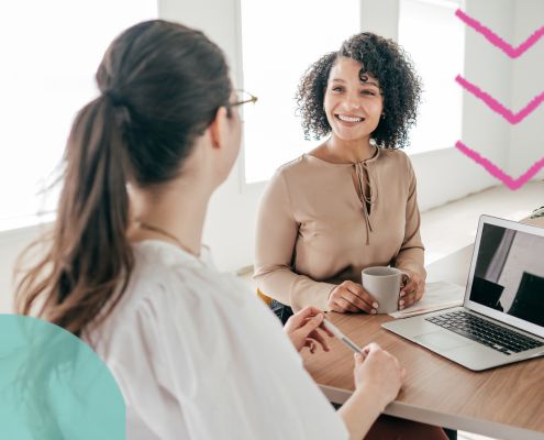 HR leader talking through the hiring process with a hiring manager